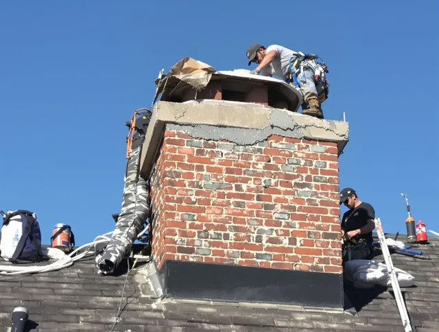 Oxford Chimney Sweep installing a custom chimney crown in Oxford, CT