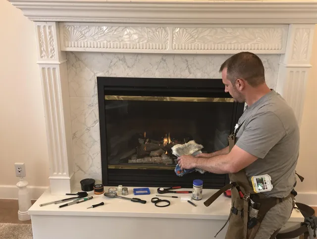 Oxford Chimney Sweep performing fireplace maintenance in Oxford, CT
